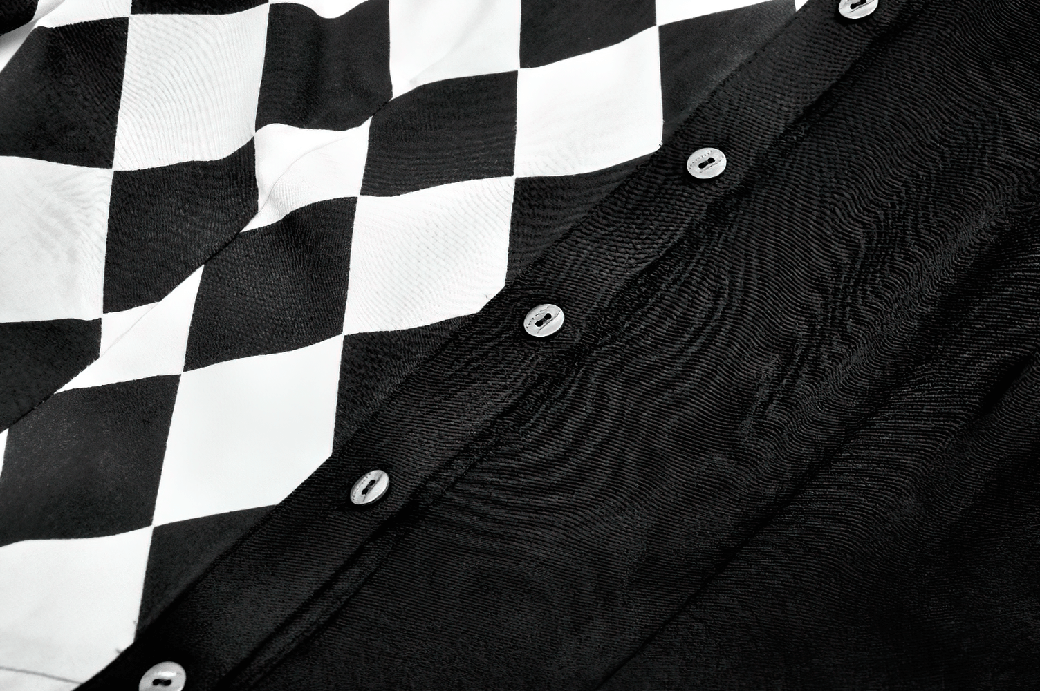 Harlequin Diamond Pattern Shirt with Front Button Detail featuring bold black and white diamond patterns.