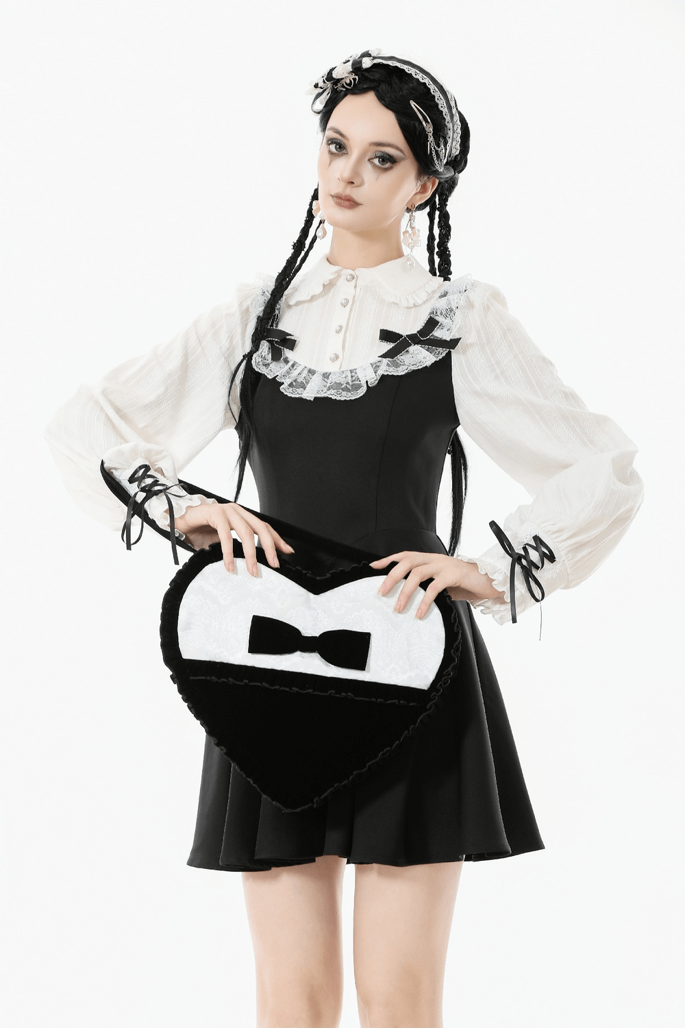 Heart-Shaped Gothic Lace Bow Crossbody Bag showcased with a stylish outfit, perfect for gothic fashion lovers.