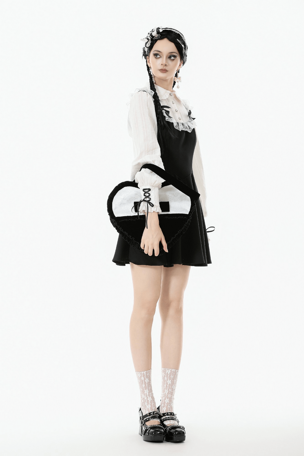 Heart-Shaped Gothic Lace Bow Crossbody Bag showcased with a stylish black outfit and elegant accessories.