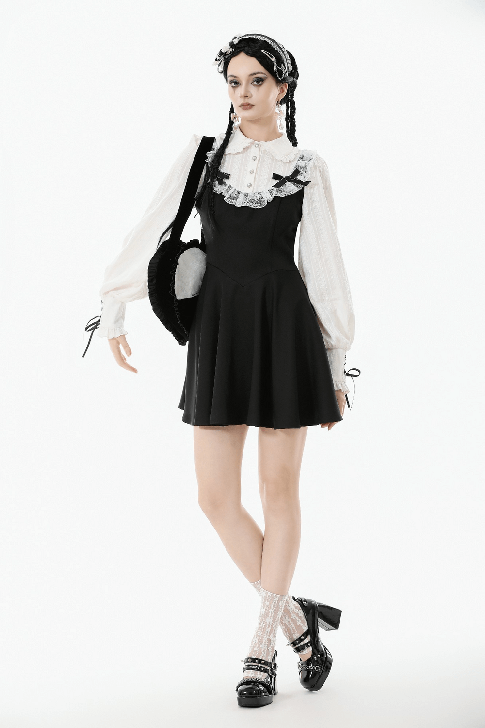 Heart-Shaped Gothic Lace Bow Crossbody Bag worn with a stylish black dress and lace socks.