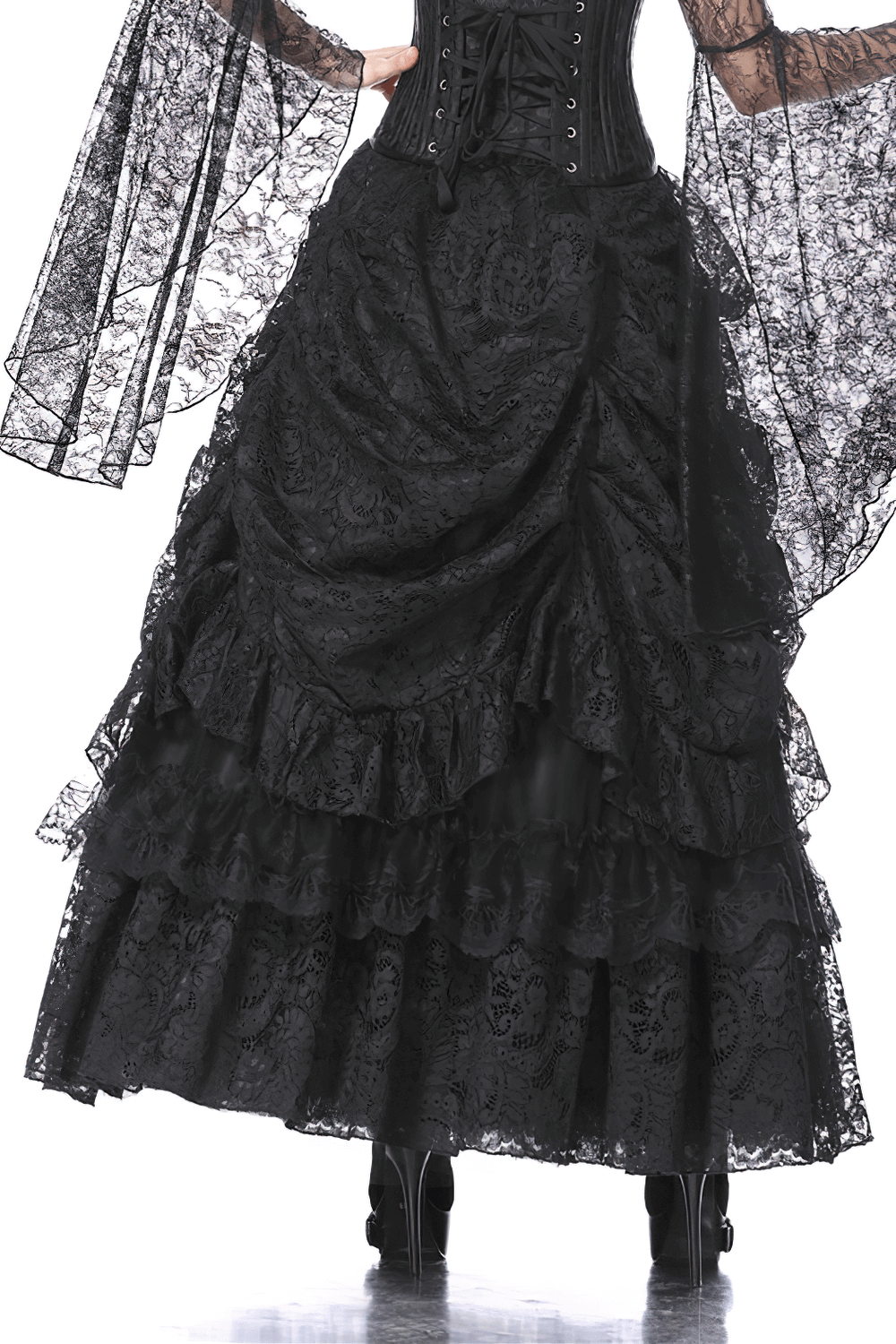 Luxe black lace maxi skirt with dramatic high-low silhouette and ruffled layers, perfect for a night out or elegant occasion.