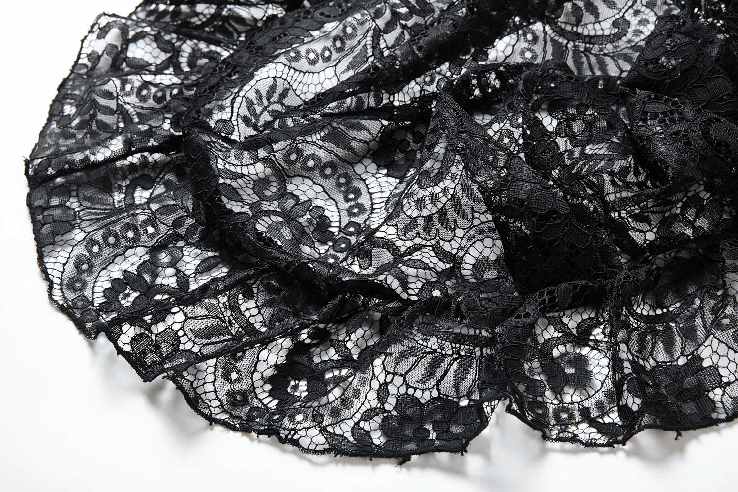 Elegant black lace fabric showcasing intricate floral patterns and delicate ruffles for a dramatic look.
