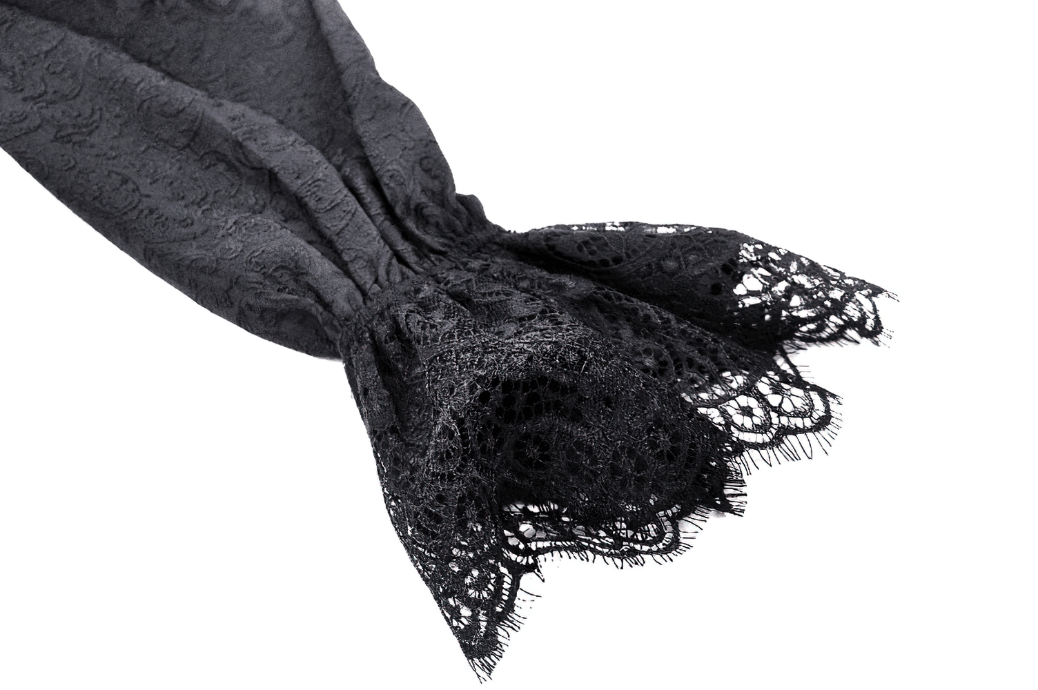 Close-up of black lace sleeve detail from a high-low lace tailcoat, showcasing intricate patterns.