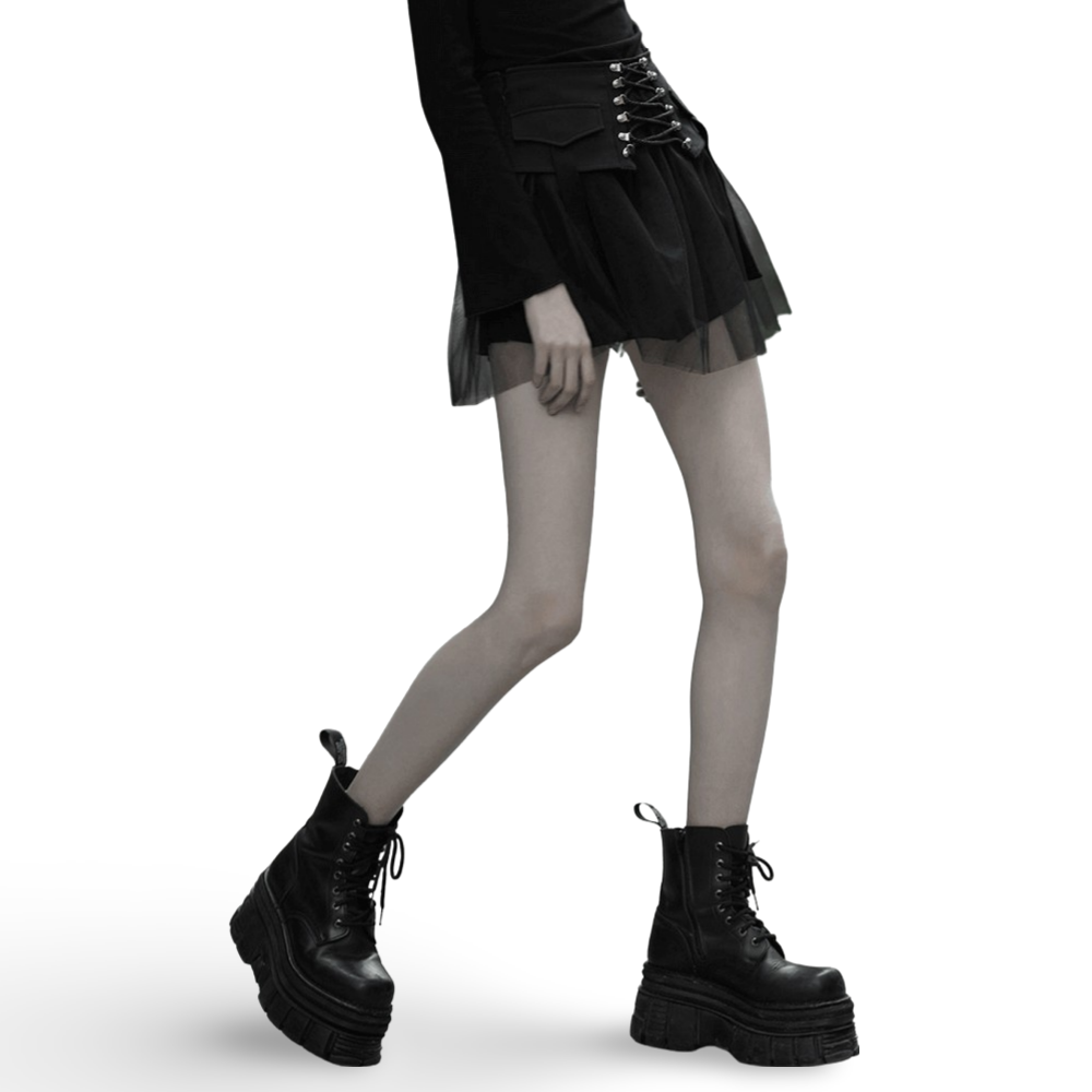 Model showcases a High-Waist Black Gothic Skirt with lace-up detail, paired with chunky black combat boots, exuding punk style.