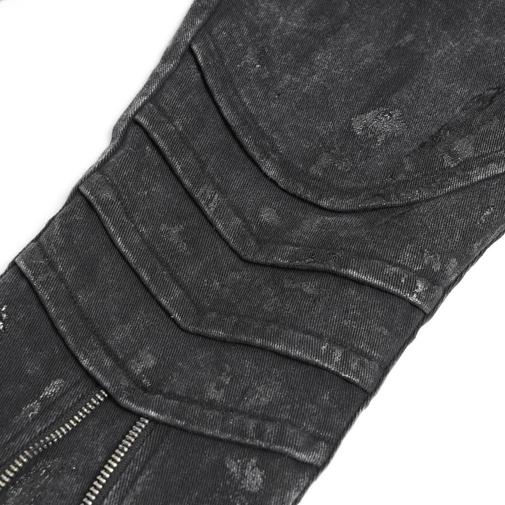 Close-up of high waist flared jeans showcasing unique zipper and layered detail for an edgy punk look.