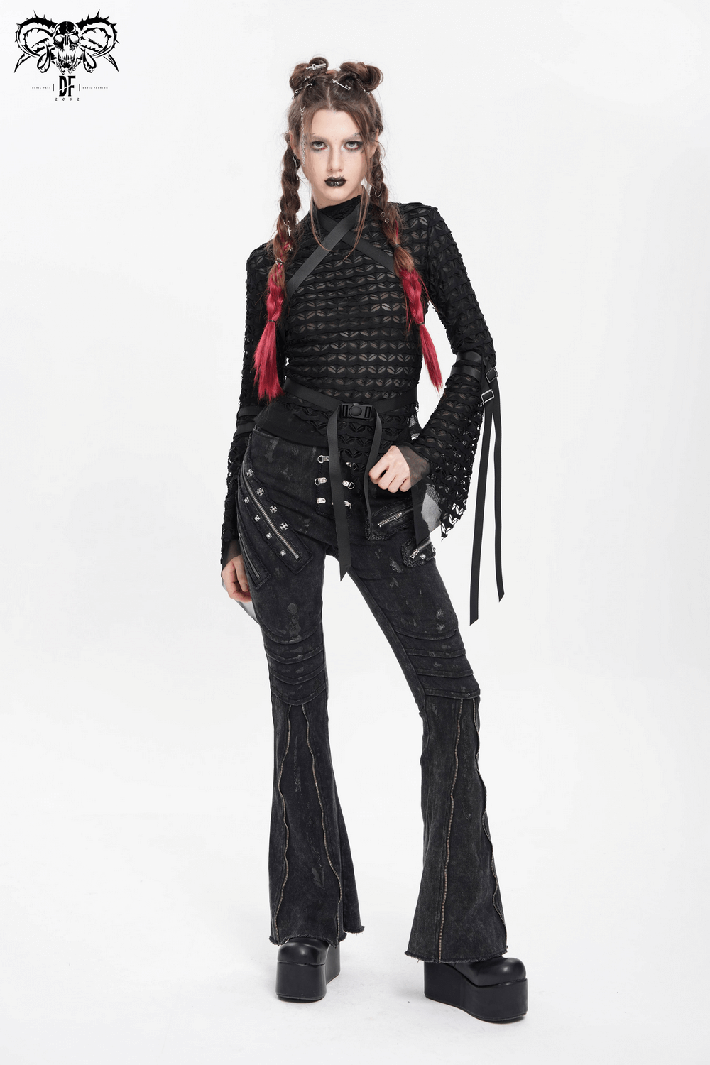 Model wearing punk high waist flared jeans with buckle and zipper details, styled with a gothic top and platform boots.