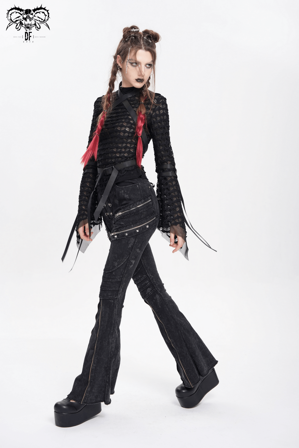 Model wearing high waist flared jeans with buckles and chains, showcasing a bold punk look in black.