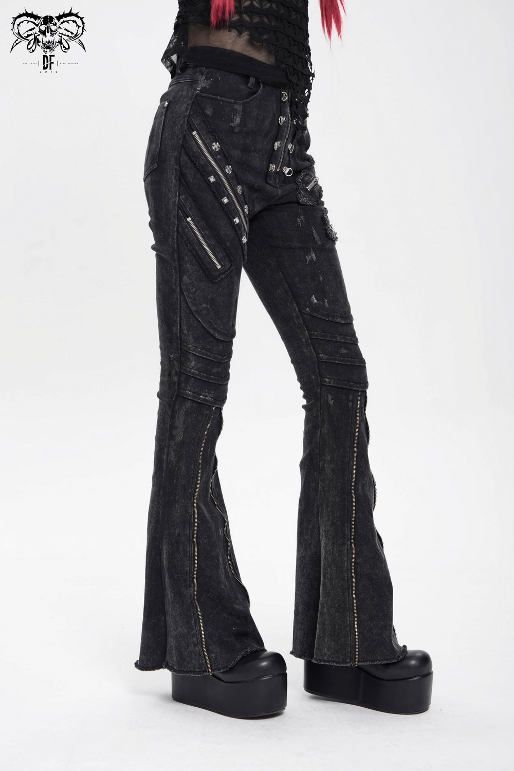 Edgy high waist flared jeans with buckles and zipper details, paired with platform boots for a punk look.