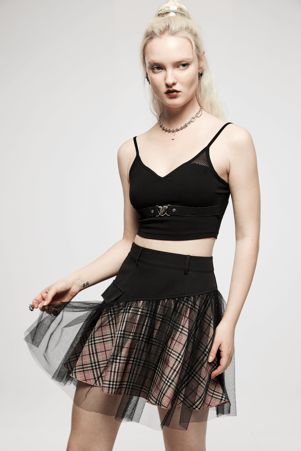 High-waisted gothic short skirt with pink plaid and black mesh accents, perfect for a punk princess look.