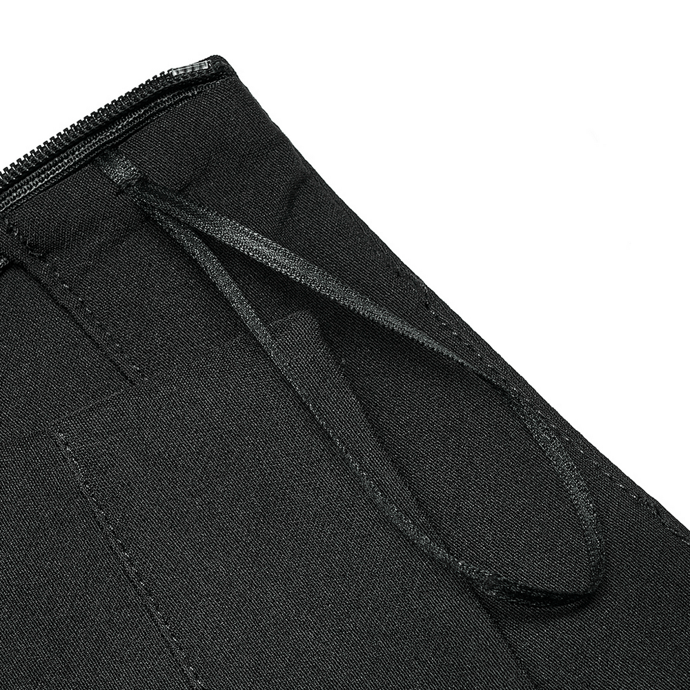 Close-up of high-waisted black skirt detailing, showcasing zipper and stylish drawstring accents.