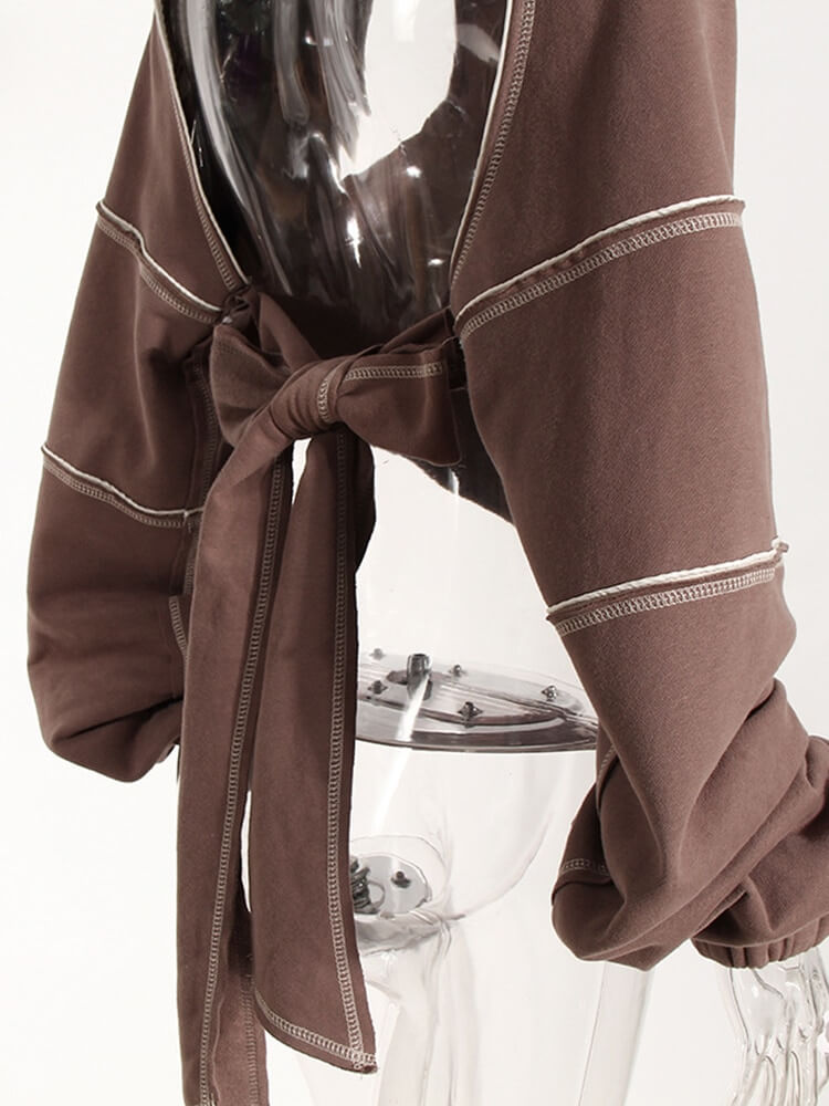 Hollow-out long sleeves hooded sweatshirt in brown, featuring a trendy tie detail and stylish backless design.