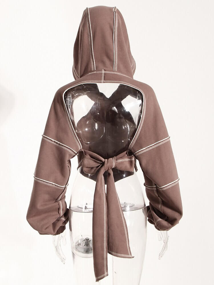 Back view of a stylish brown hollow-out hoodie with long sleeves and a bow tie, perfect for trendy women.