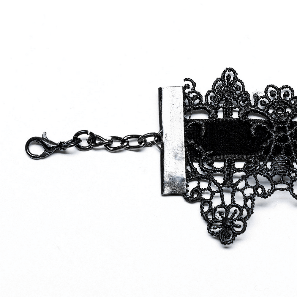Close-up of black lace choker with adjustable chain and intricate detailing for a Victorian goth look.