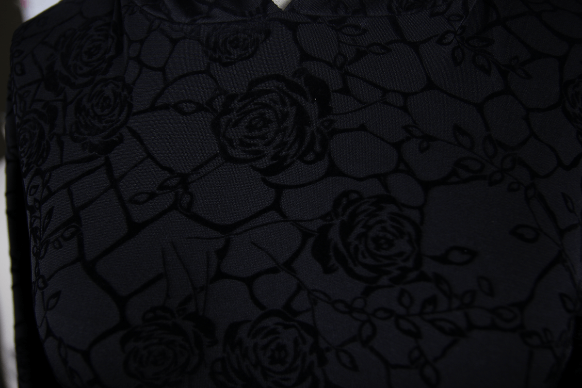 Close-up of the floral black fabric featuring subtle rose patterns, perfect for gothic mini dresses.