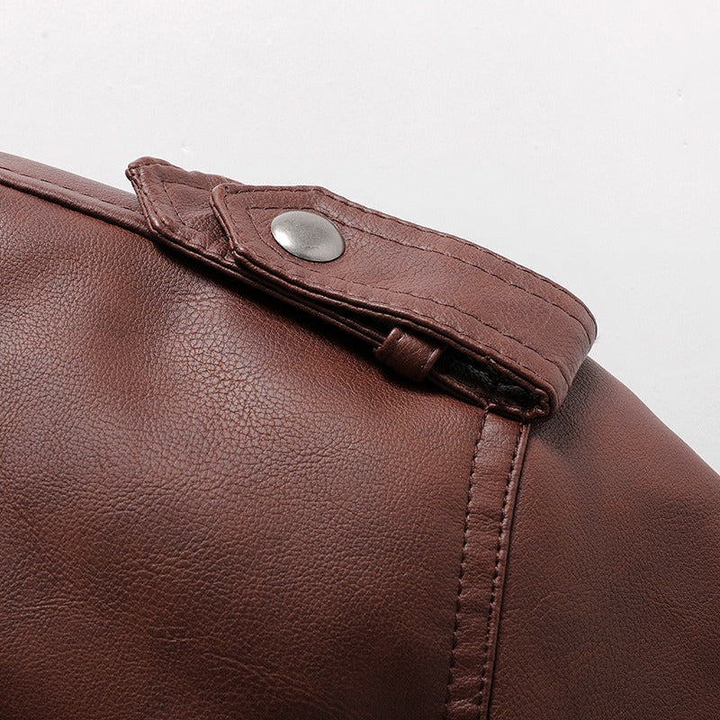 Close-up of a brown hooded leather jacket showcasing stylish button details and textured faux leather finish.
