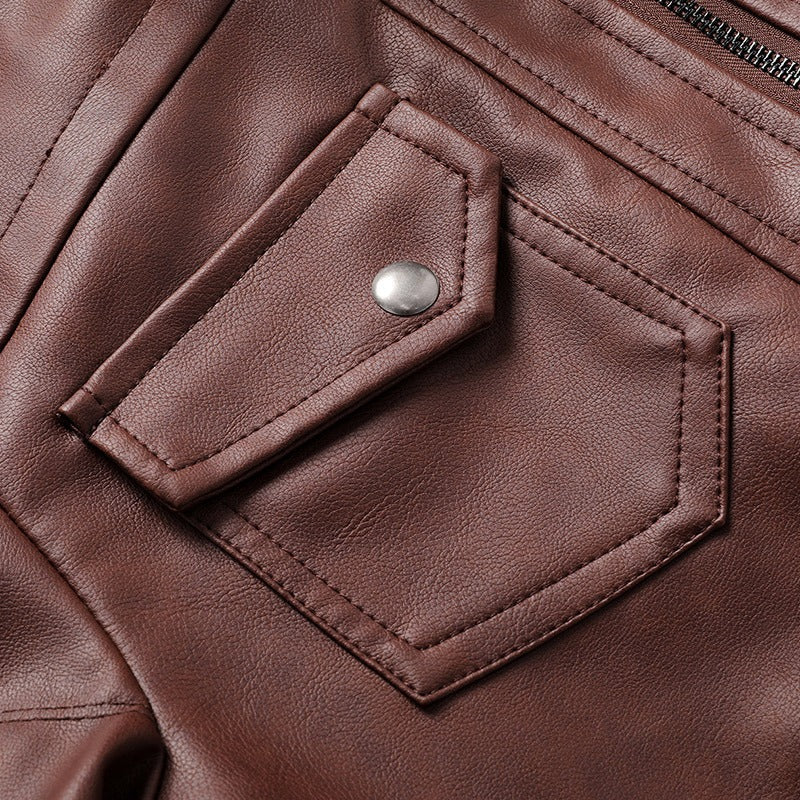 Close-up of the stylish pocket detail on a brown hooded leather jacket, perfect for casual and motorcycle wear.
