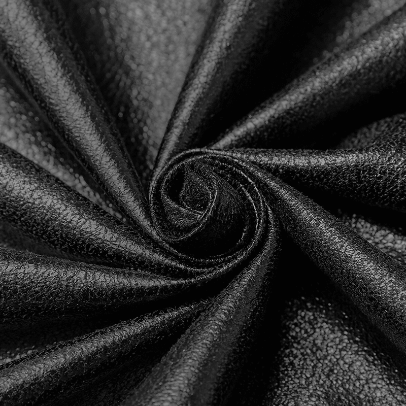 Luxurious black fabric, perfect for cloaks and costumes, showcasing a smooth and elegant texture.
