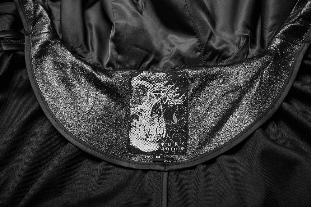 Interior label of a Hooded Longline Black Cloak featuring a gothic skull design, perfect for themed events and cosplay.