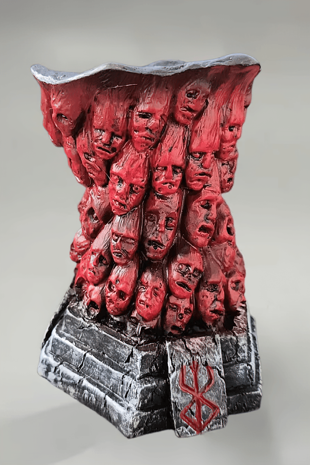 Horror Skull Tealight Holder for Gothic Decor - eerie resin candle holder with carved faces and red details.