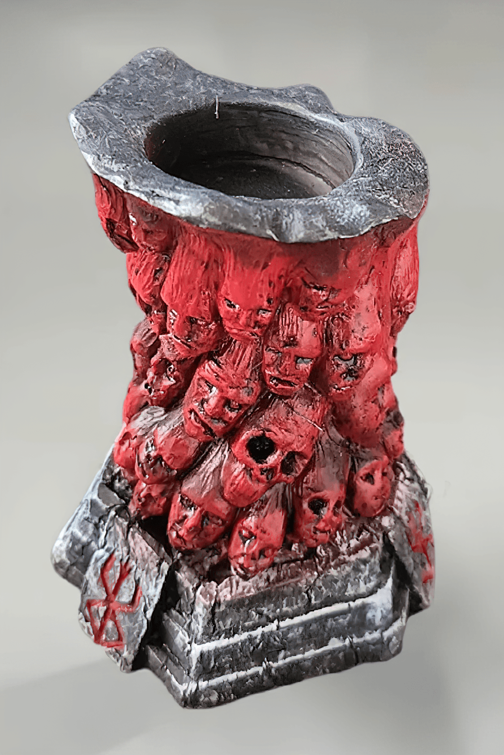 Horror Skull Tealight Holder for Gothic Decor with carved faces and a demonic red column.