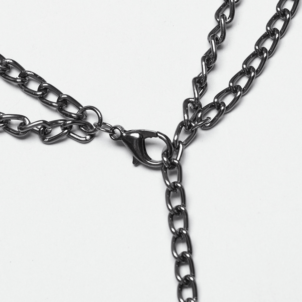 Close-up of a gothic black chain with intricate links and a secure clasp, perfect for adding edge to jewelry.