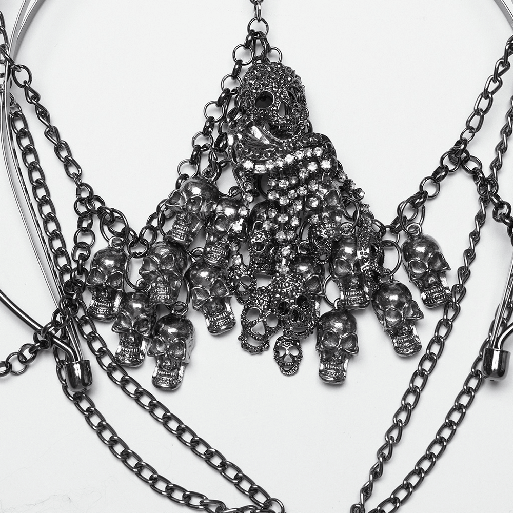 Gothic crown featuring skull pendants, chains, and rhinestones, perfect for a statement piece in dark fashion.