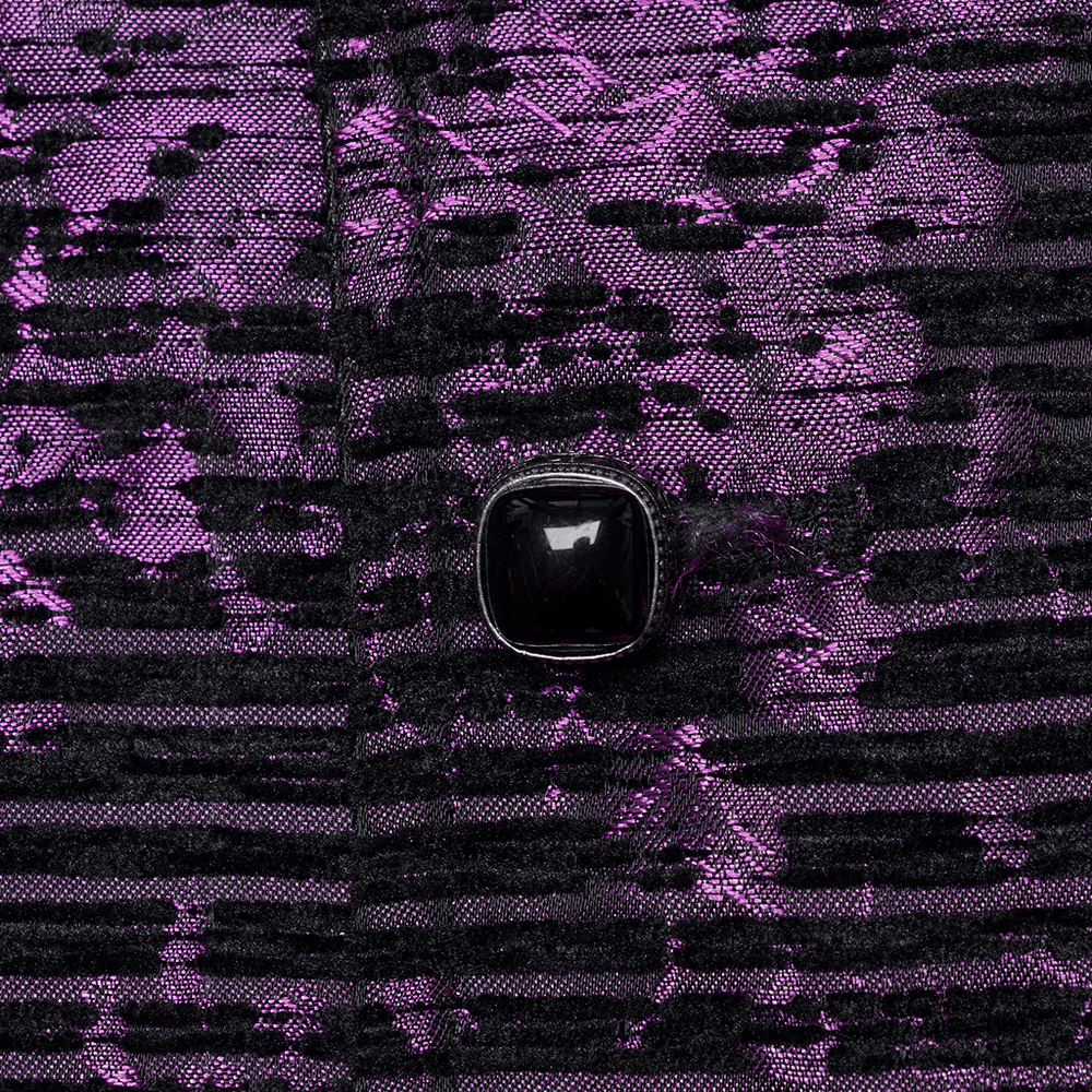 Close-up of the purple jacquard waistcoat showcasing a gemstone buckle on an elegant fabric background.