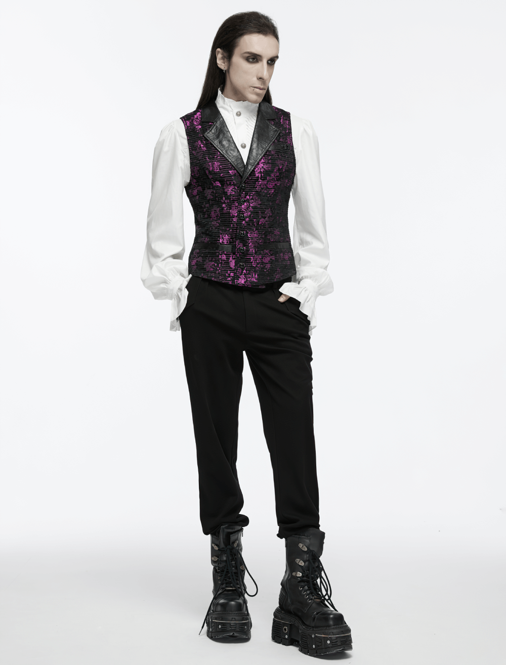 Stylish model in a Gothic jacquard waistcoat with leather details, paired with a white shirt and black trousers.