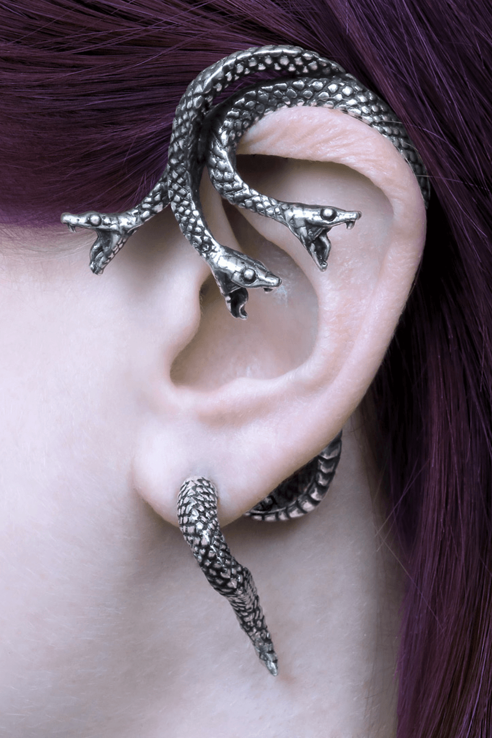 Khthonis three-headed serpent ear wrap showcasing intricate design on left ear with surgical steel post.