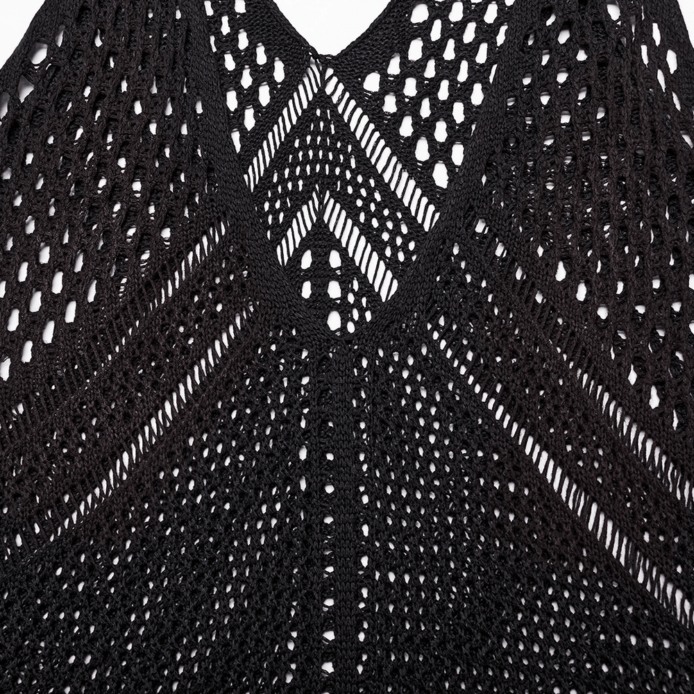 Close-up of the knitted hollow design on a post-apocalyptic techwear dress in black, featuring a bold V-neck.