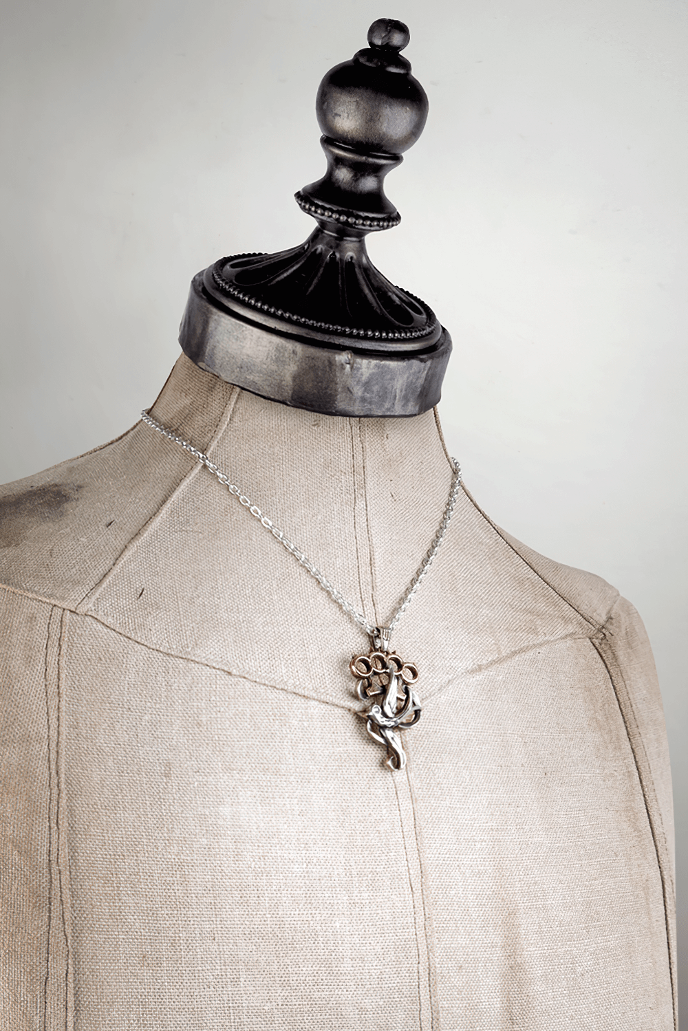 Knuckleduster with Swallow and Swarovski Crystals Pendant displayed on a vintage mannequin.