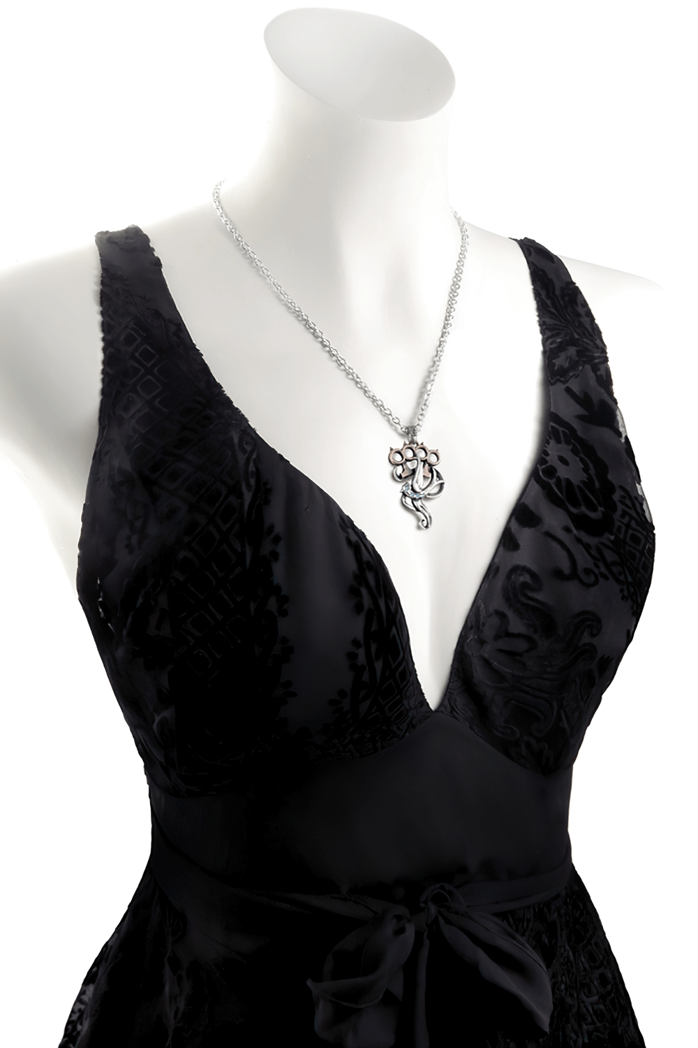 Knuckleduster with Swallow and Swarovski Crystals Pendant showcased on a black dress with a sleek design.