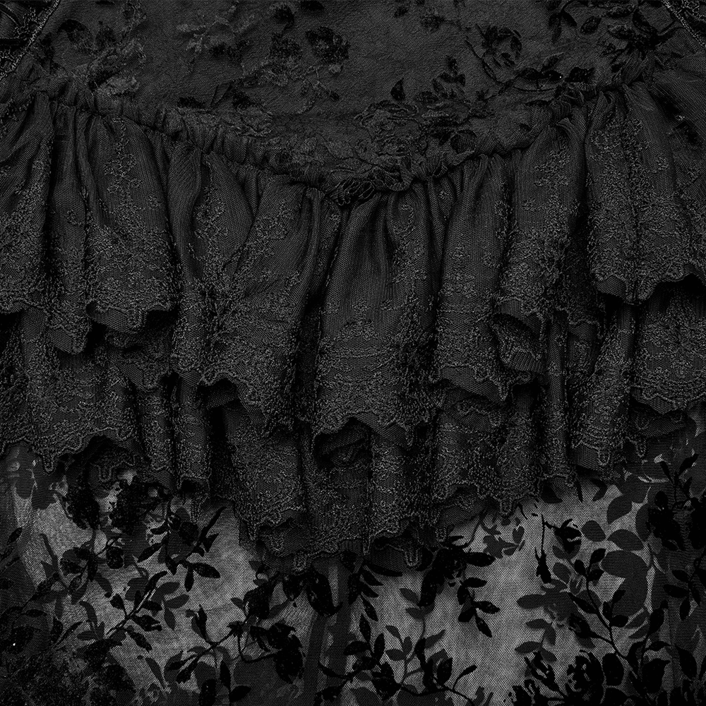 Intricate black lace trim on a gothic full-length skirt showcasing delicate ruffles and flocking pattern details.