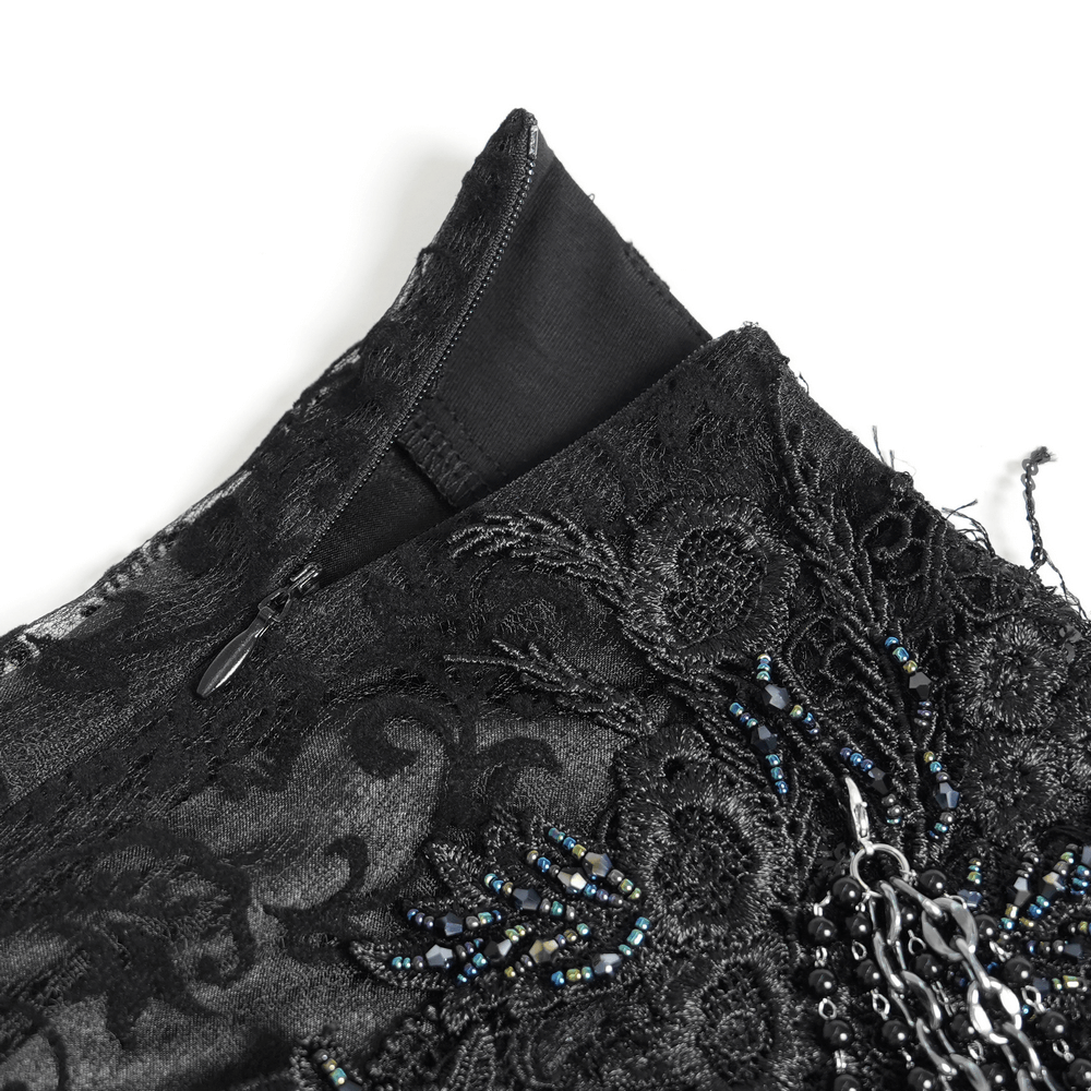 Close-up of Lace and Fringe Black Skirt with Chains for Elegance Style showcasing intricate detailing and zipper.