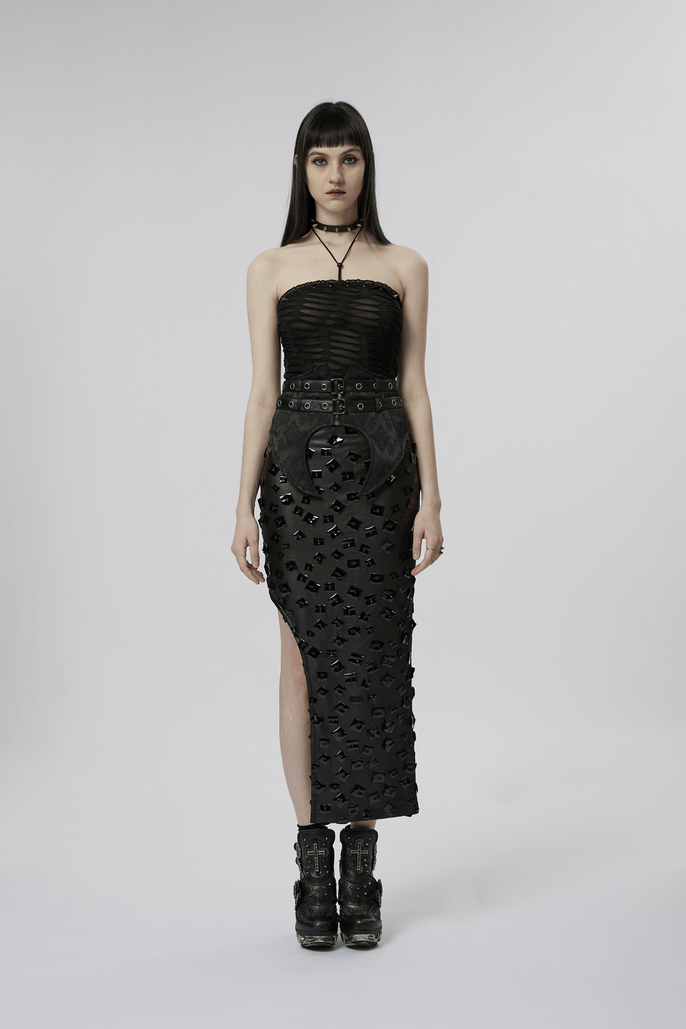 Gothic bustier with lace and rivet details, paired with a stylish black skirt, showcasing a punk-inspired fashion statement.