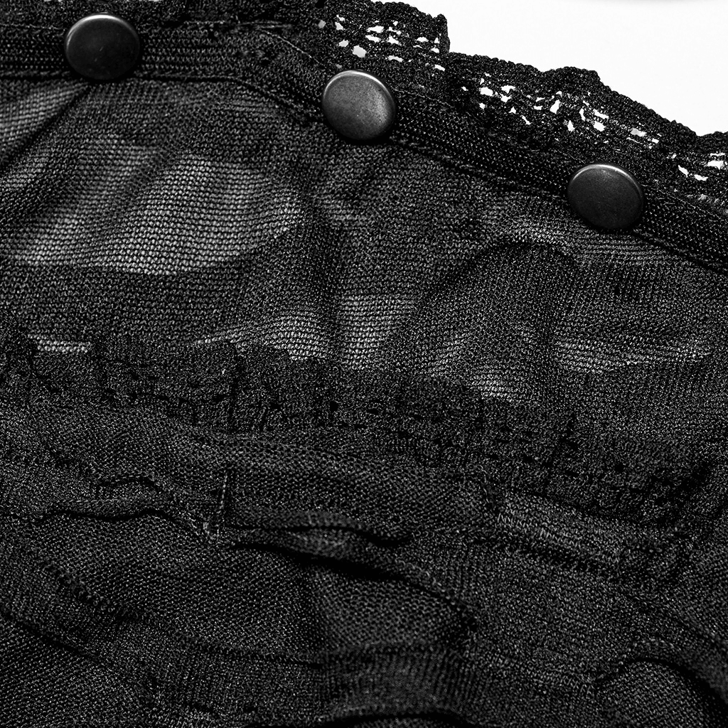 Close-up of black lace and riveted detailing on a gothic bustier, showcasing stylish accents and intricate fabric texture.
