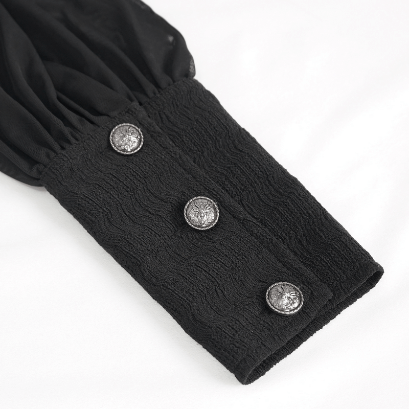 Close-up of a black blouse sleeve with textured fabric and decorative silver buttons for a gothic style look.