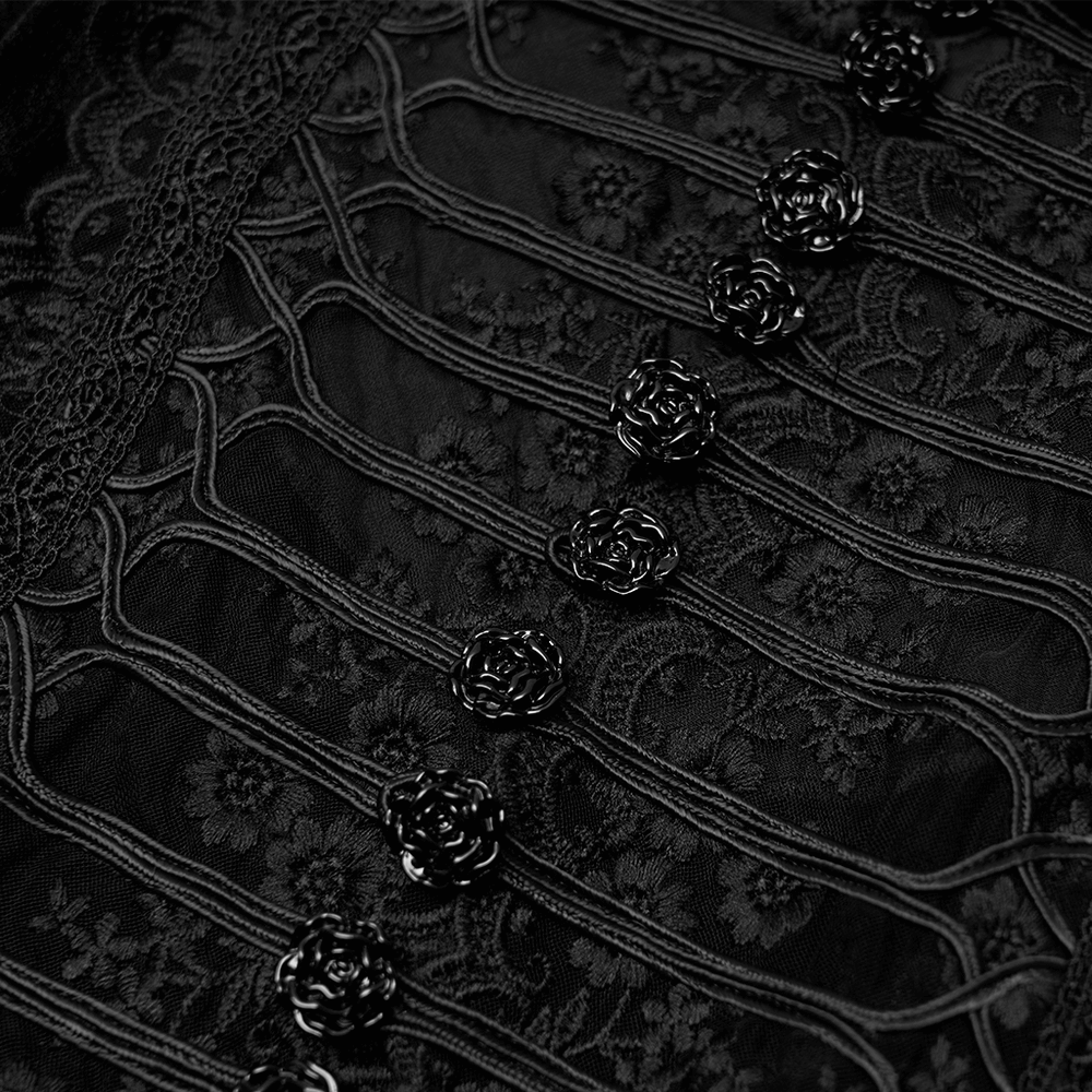 Close-up of black lace and rose buttons on a Gothic velvet dress, showcasing elegant Victorian-inspired details.
