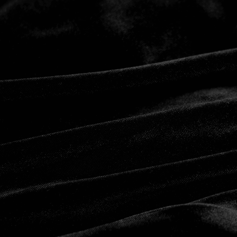 Close-up of soft black velvet fabric showcasing elegant texture and luxurious feel, perfect for gothic fashion.