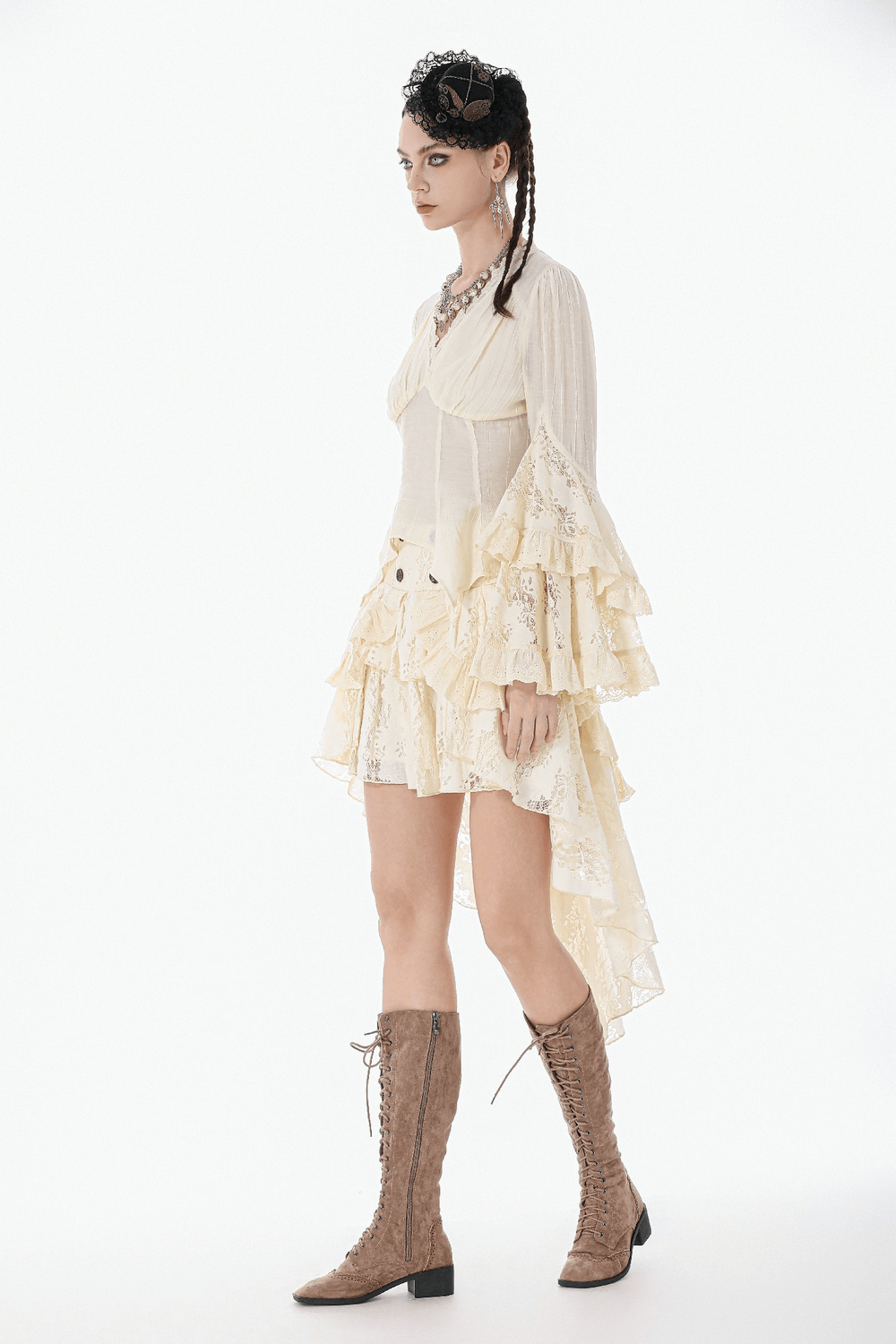 Model wearing Lace Detail Gothic Bell Sleeved Top with Corset Back paired with a flowing ruffled skirt and lace-up boots.