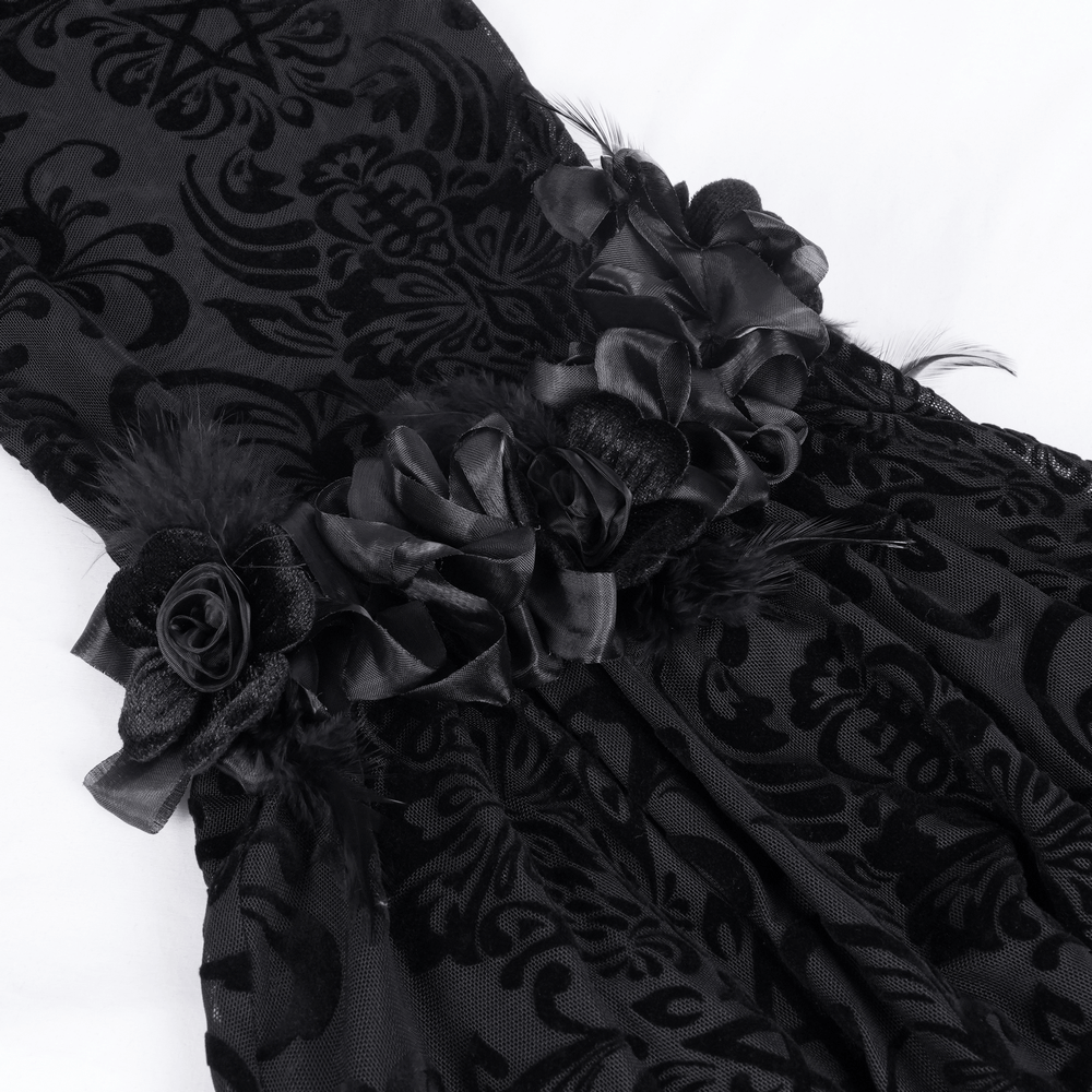Intricate black velvet pants with lace ruffles and floral motifs, perfect for gothic-inspired fashion.
