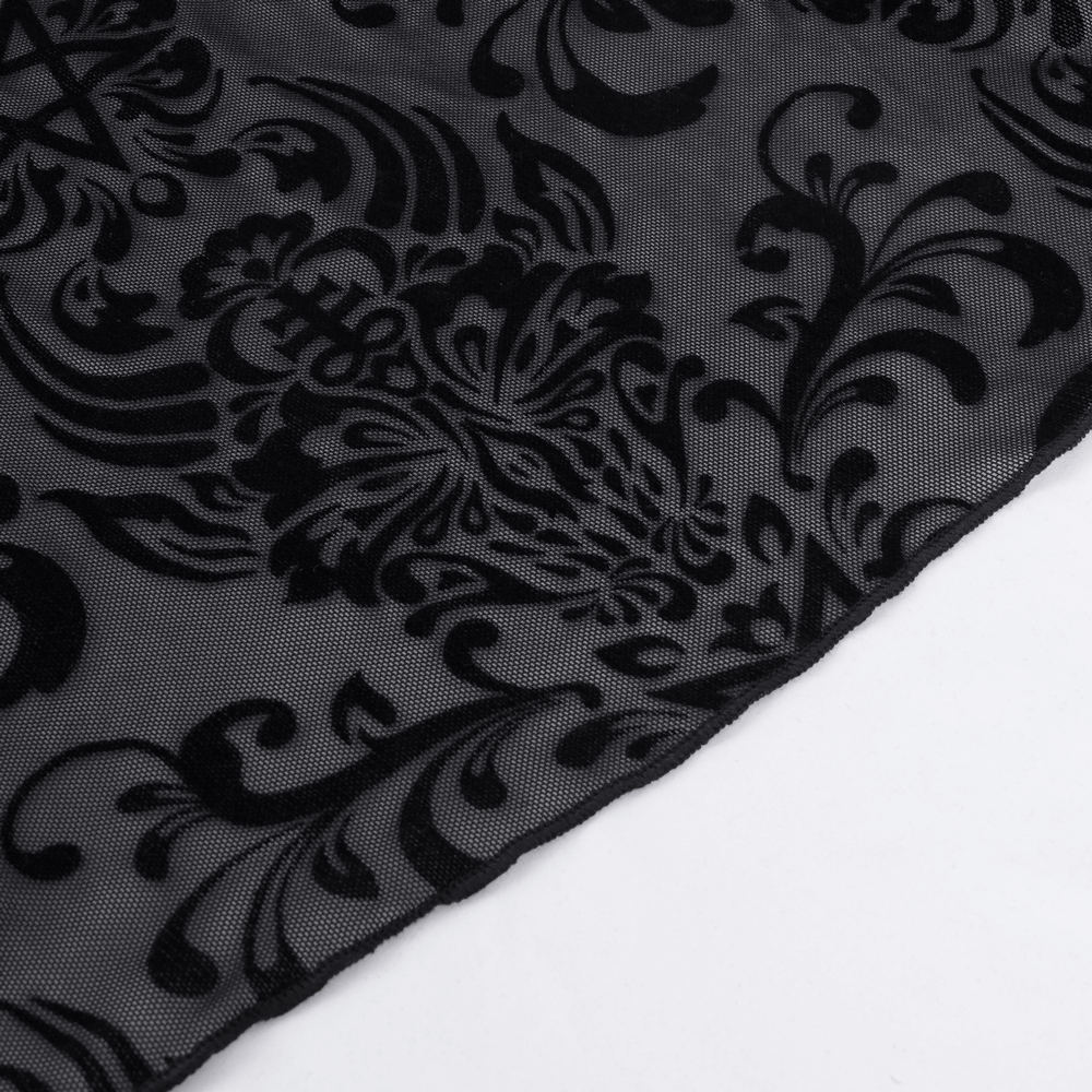 Close-up of intricate black velvet floral pattern on sheer fabric for gothic lace flare pants.