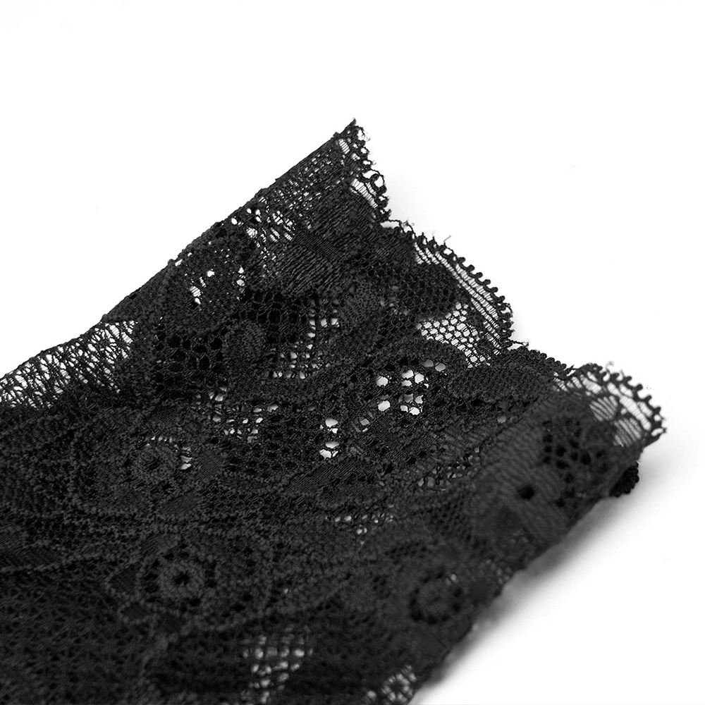 Close-up of intricate black lace fabric featuring a floral pattern, perfect for gothic-inspired designs.