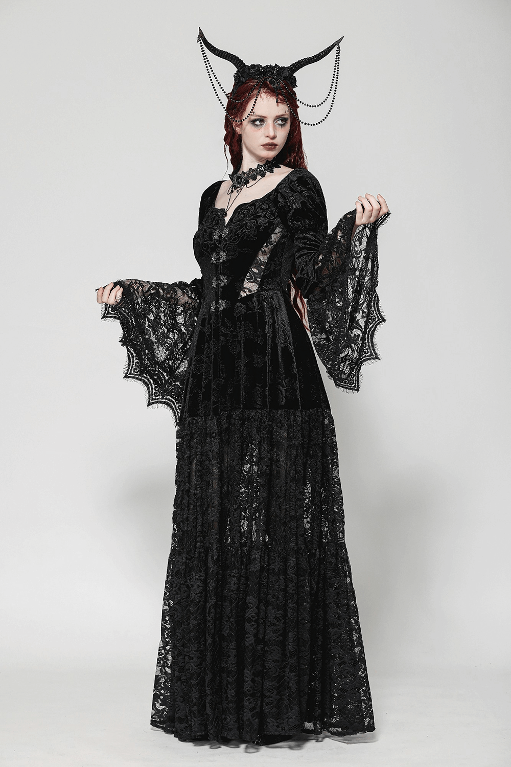 Gothic black lace evening cape with floral accents, featuring long sleeves and a Victorian-inspired design.