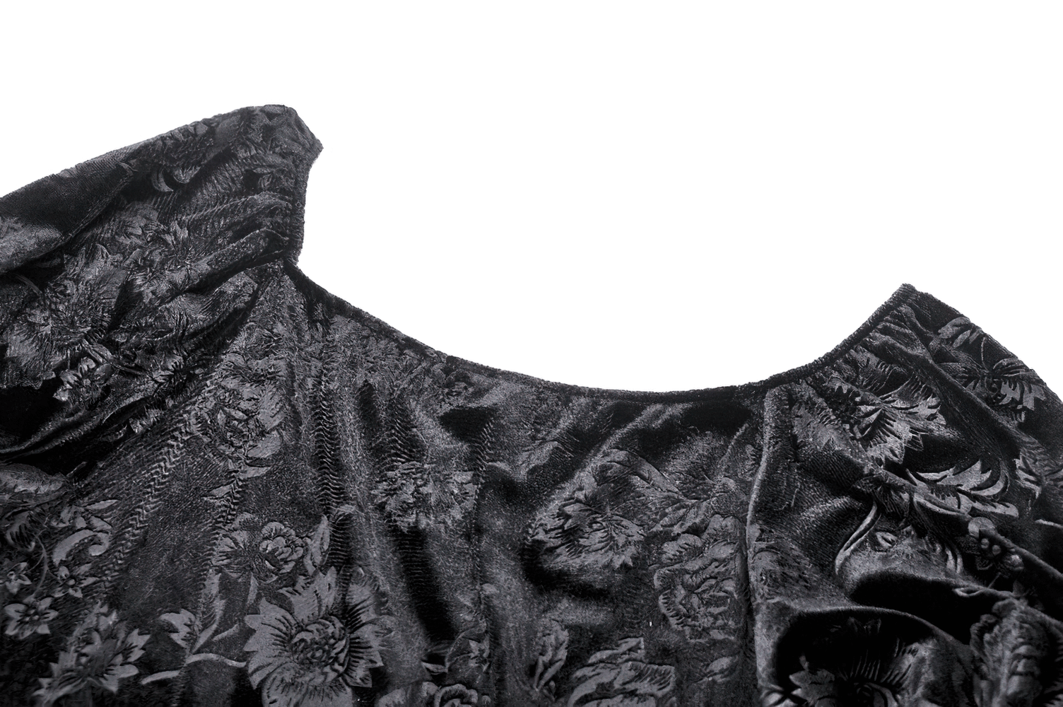 Intricate black floral lace fabric detail of a Gothic Victorian-inspired evening cape.