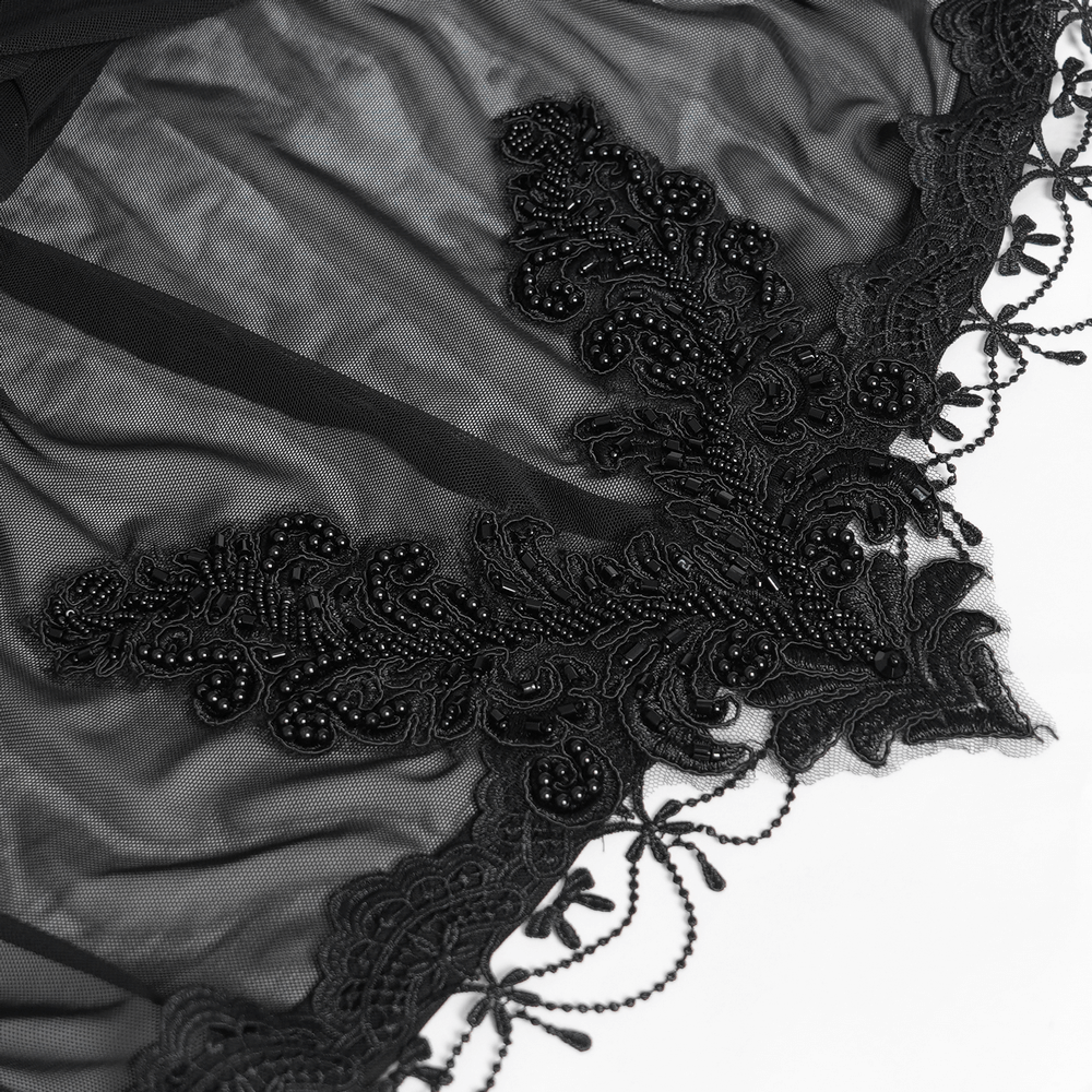 Intricate black lace detailing with beaded floral patterns on a Gothic hooded cape.