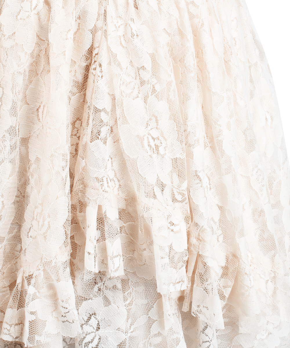 Close-up of layered ivory lace skirt showcasing delicate floral patterns and ruffled hem, perfect for gothic or boho styles.