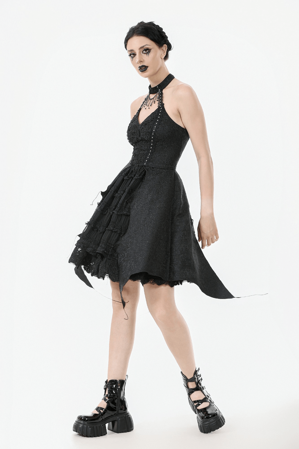 Lace halter corset dress with choker and asymmetrical hem, featuring a stylish design and edgy platform boots.