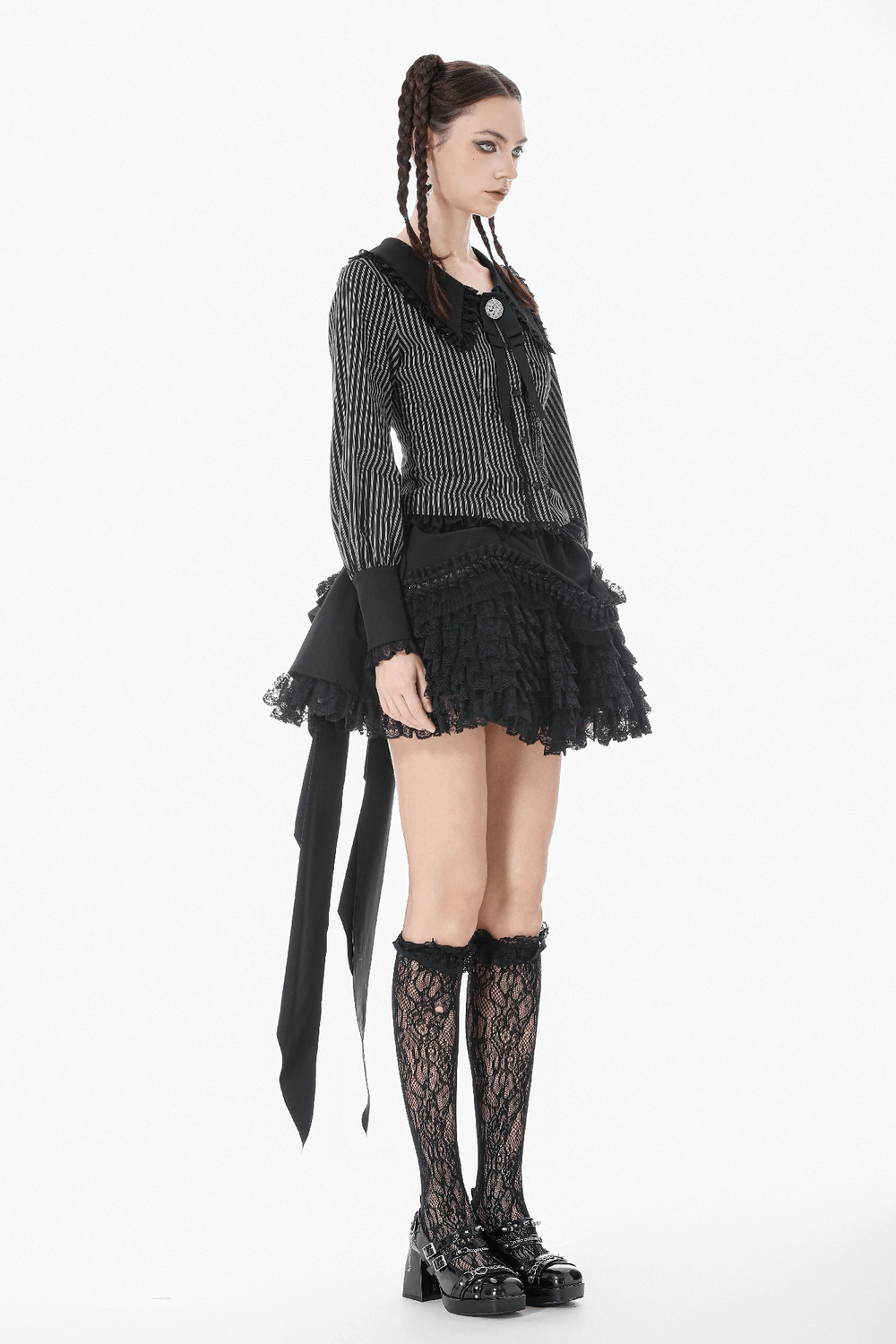 Lace Layered Black Tulle Skirt with Ribbon Detail worn by a model showcasing punk style and gothic flair.