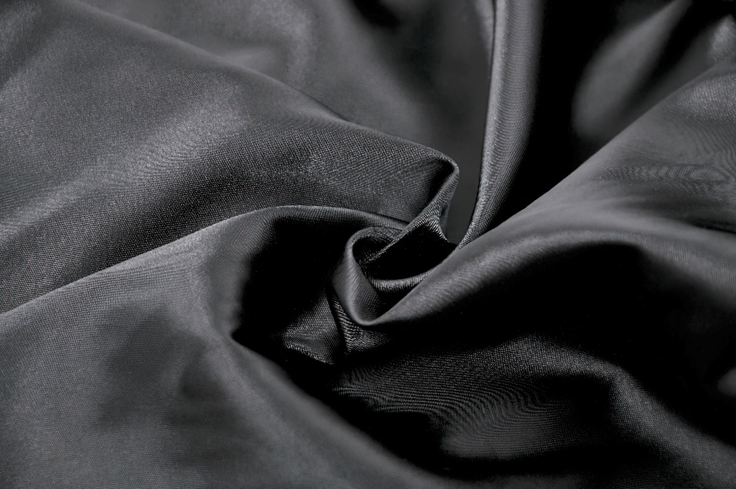 Close-up of luxurious black fabric, perfect for a Lace Layered Skirt with Drawstring Waist and Ruffled Hem.